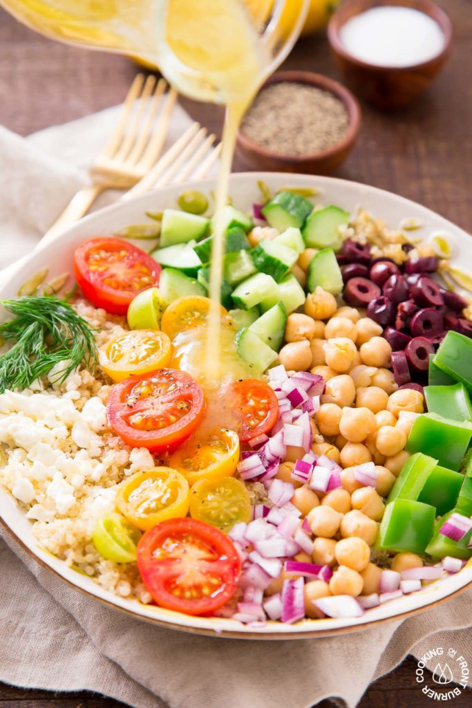 Dressing being poured over salad