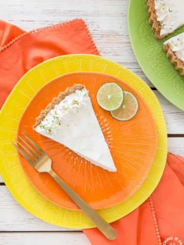 Light and refreshing describes this no-bake Frozen Margarita Tart.  You will love the creamy whipped texture with fresh lime juice, lime zest, triple sec, tequila mixture all piled into a salty pretzel crust.  