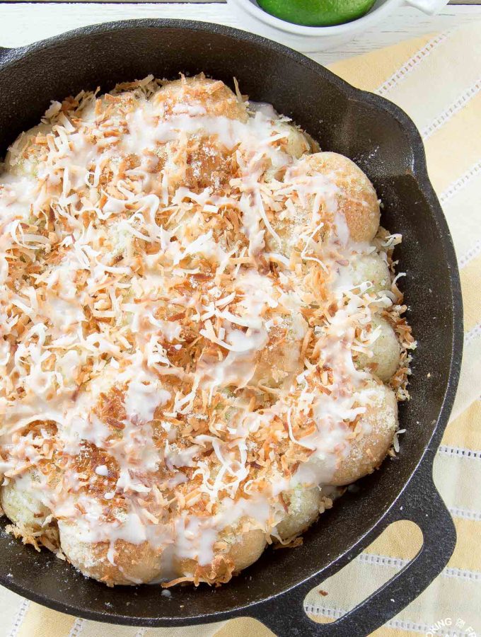 These Lime Coconut Skillet Rolls are a perfect way to celebrate spring. The light and fluffy rolls are topped with lime zest, sweet coconut and drizzled with a lime glaze.