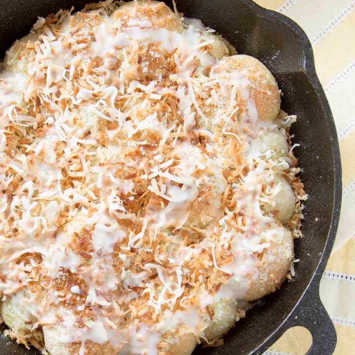 These Lime Coconut Skillet Rolls are a perfect way to celebrate spring.  The light and fluffy rolls are topped with lime zest, sweet coconut and drizzled with a lime glaze.