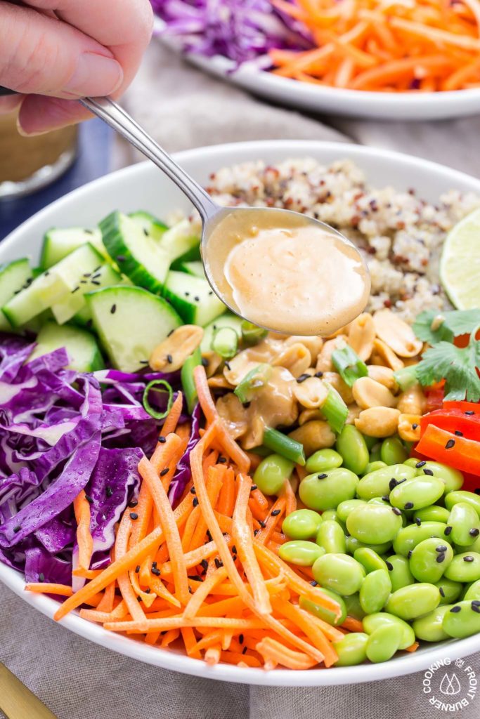 Peanut Dressing poured on Asian Quinoa Salad