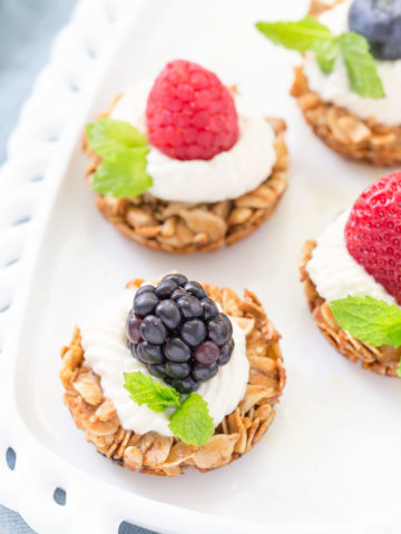 These bite sized Fruit Yogurt Granola Bites would be a great addition to your Mother's Day brunch table.  Use your favorite yogurt on top of the crunchy oatmeal and honey tart shell then add fresh fruit berries to finish it off!