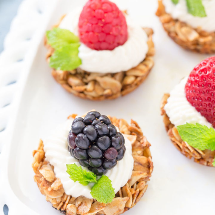 These bite sized Fruit Yogurt Granola Bites would be a great addition to your Mother's Day brunch table.  Use your favorite yogurt on top of the crunchy oatmeal and honey tart shell then add fresh fruit berries to finish it off!