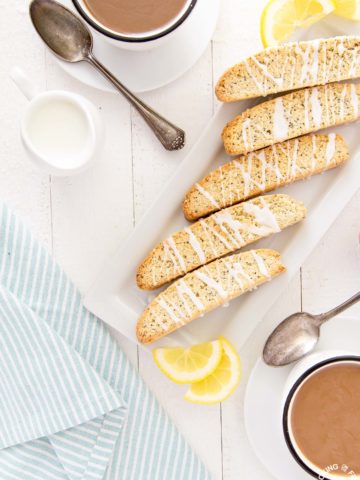 Grab a cup of coffee, a latte or some espresso (or even tea) to enjoy this Lemon Poppy Seed Biscotti to dunk this crispy and lemony treat in.  Enjoy them for breakfast, snack time or any time you have a craving for a tasty treat! #biscotti #lemon #poppyseed #breakfast