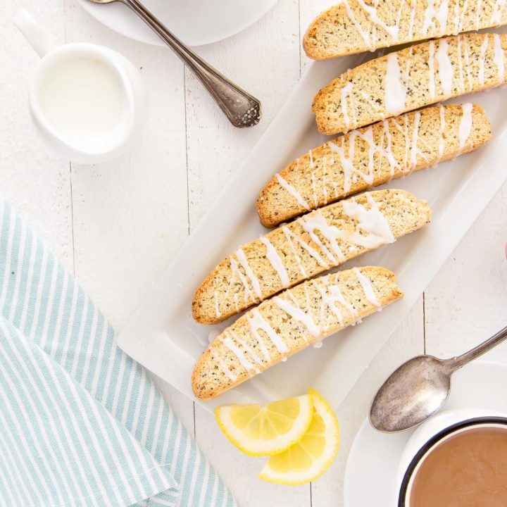 Grab a cup of coffee, a latte or some espresso (or even tea) to enjoy this Lemon Poppy Seed Biscotti to dunk this crispy and lemony treat in.  Enjoy them for breakfast, snack time or any time you have a craving for a tasty treat! #biscotti #lemon #poppyseed #breakfast