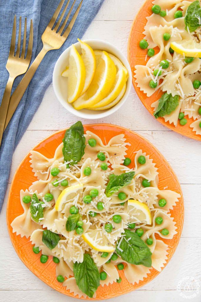 two salad plates with pasta peas