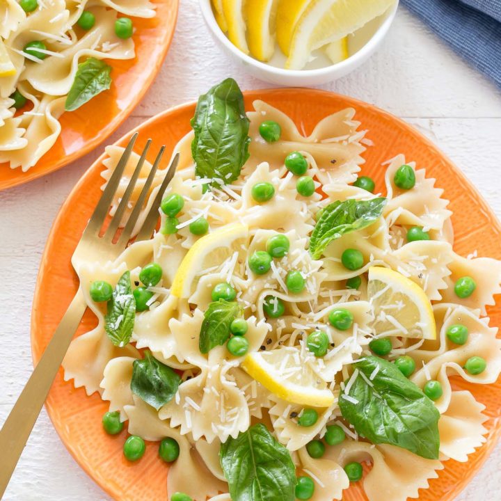 You will love how light and tasty this Springy Lemon Bow Tie Salad is with tender peas, fresh basil, bow tie shaped pasta, tangy parmesan cheese and spritzed with freshly squeezed lemon juice and tossed in olive oil.  It makes a great dish to any meal and can be whipped up in no time!