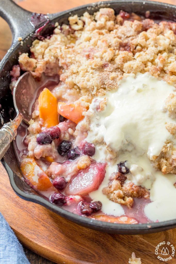 melted ice cream in blueberry peach skillet cobbler