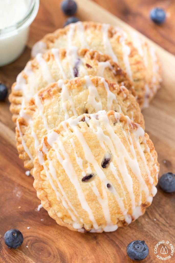 blueberry hand pies on a board