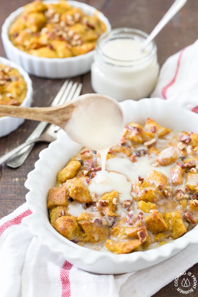 maple glaze being poured on top of bread pudding