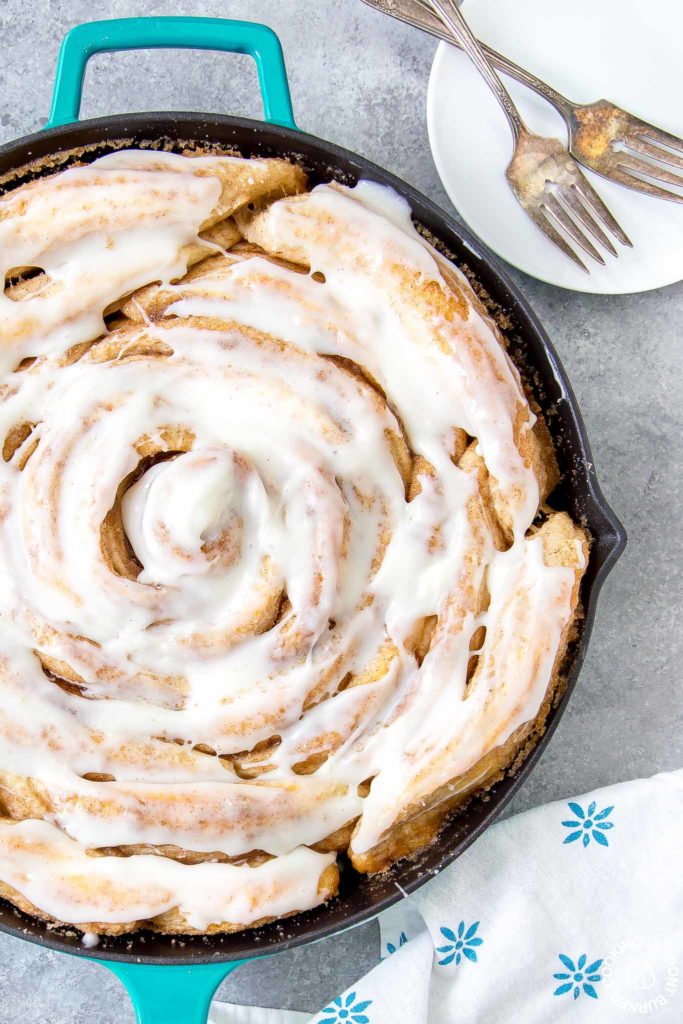 giant pumpkin spice skillet roll in a cast iron pan