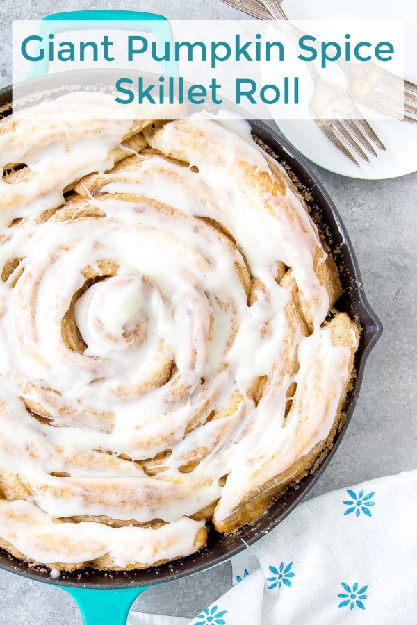 This giant Pumpkin Spice Skillet Roll is super easy to make! It starts with canned biscuits and layered in a brown sugar and spice mix with a creamy cream cheese glaze! #breakfast #pumpkinspice #skillet #onepan #easy #biscuits