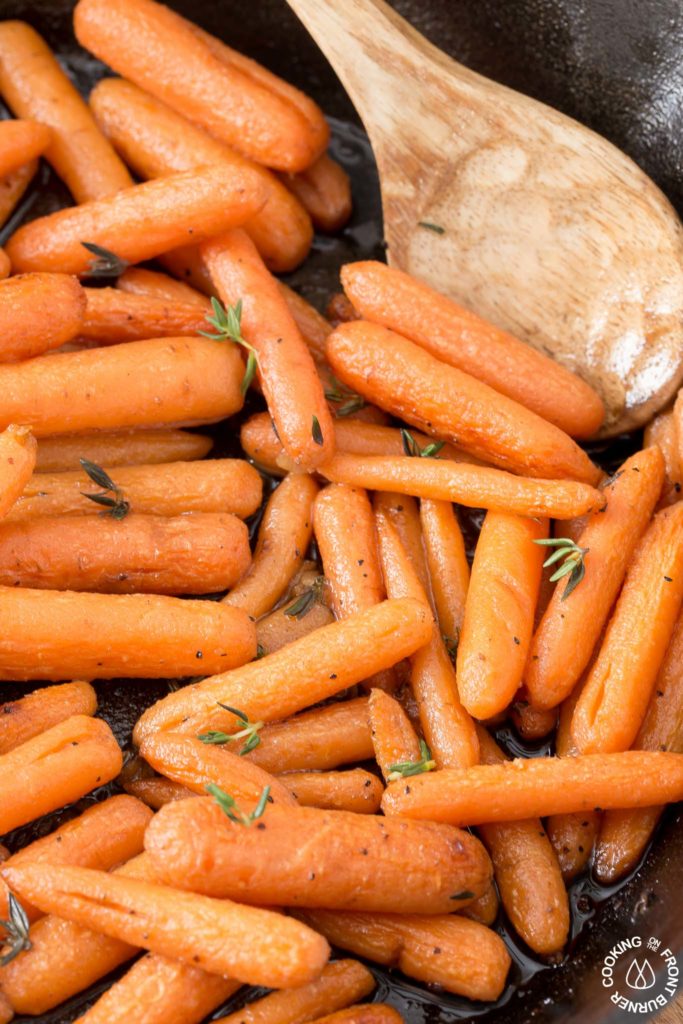 close up of glazed carrots in a skillet