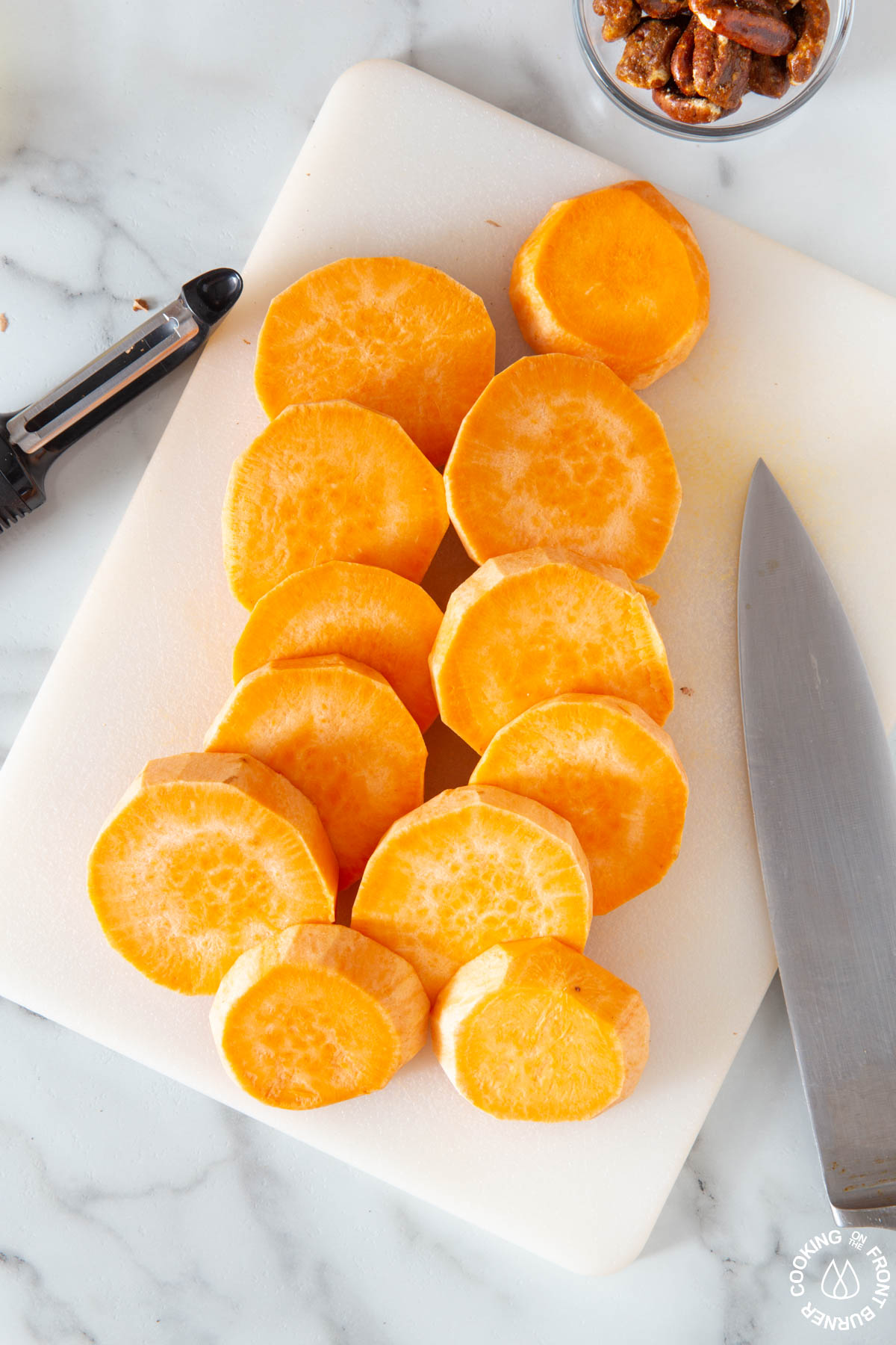 sliced sweet potatoes on a cutting board