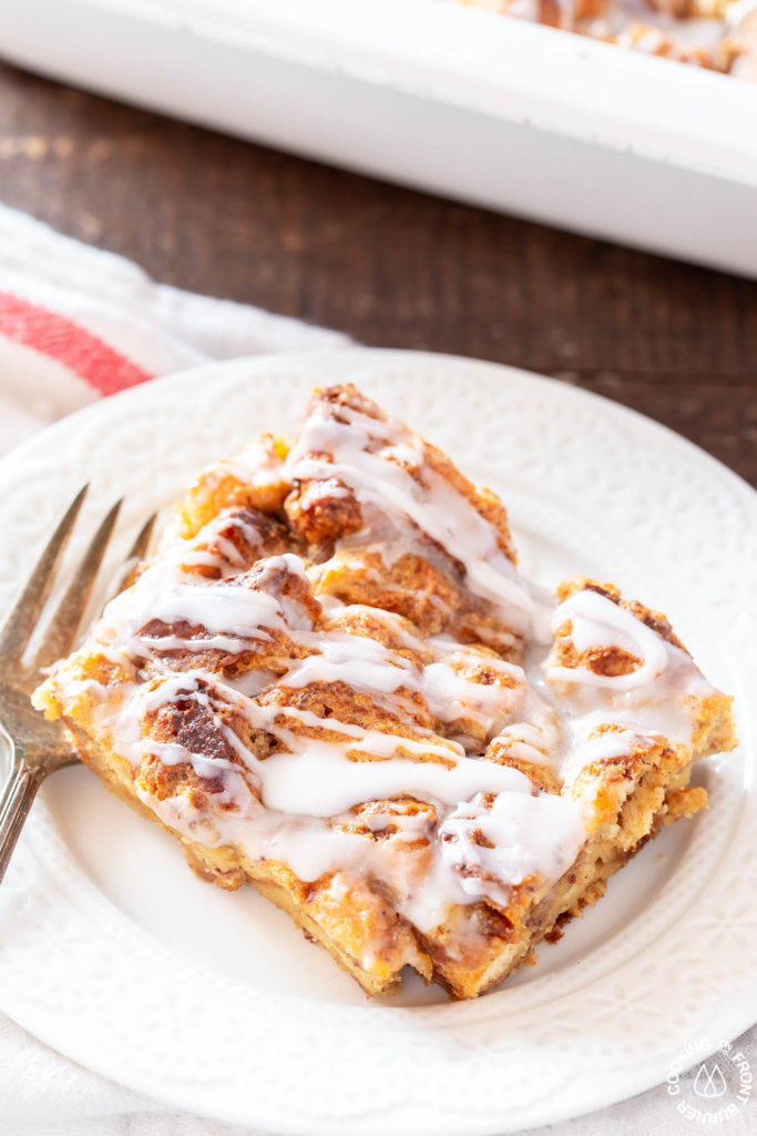 a slice of cinnamon roll pudding on a plate