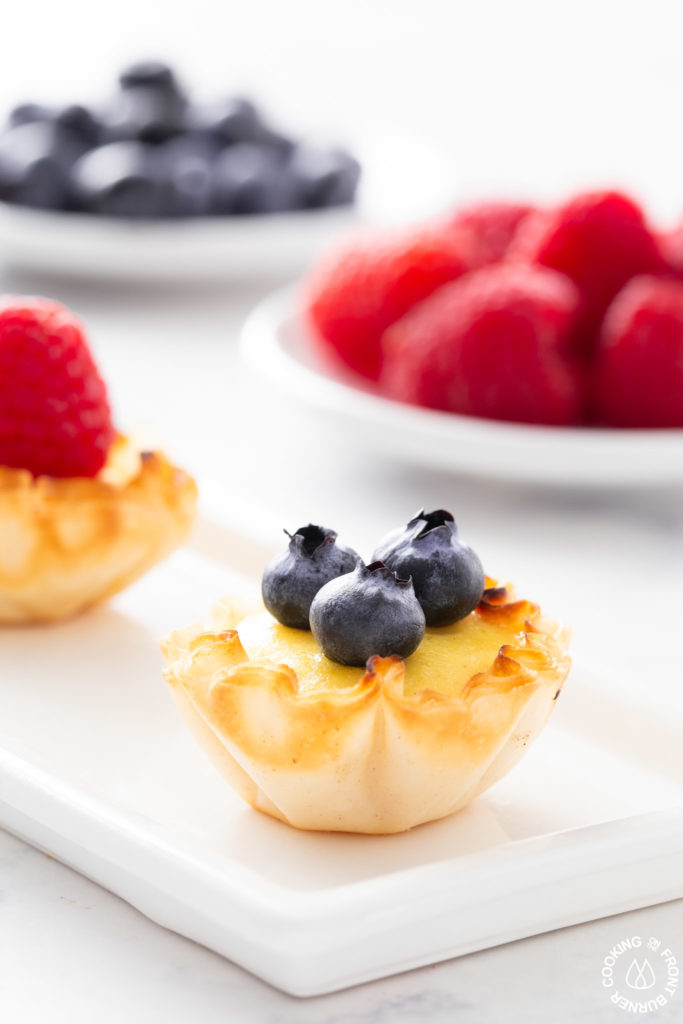 close up shot of a lemon ricotta tart on a plate