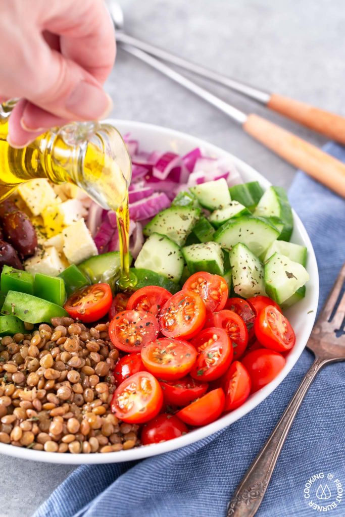 olive oil drizzled on a greek salad