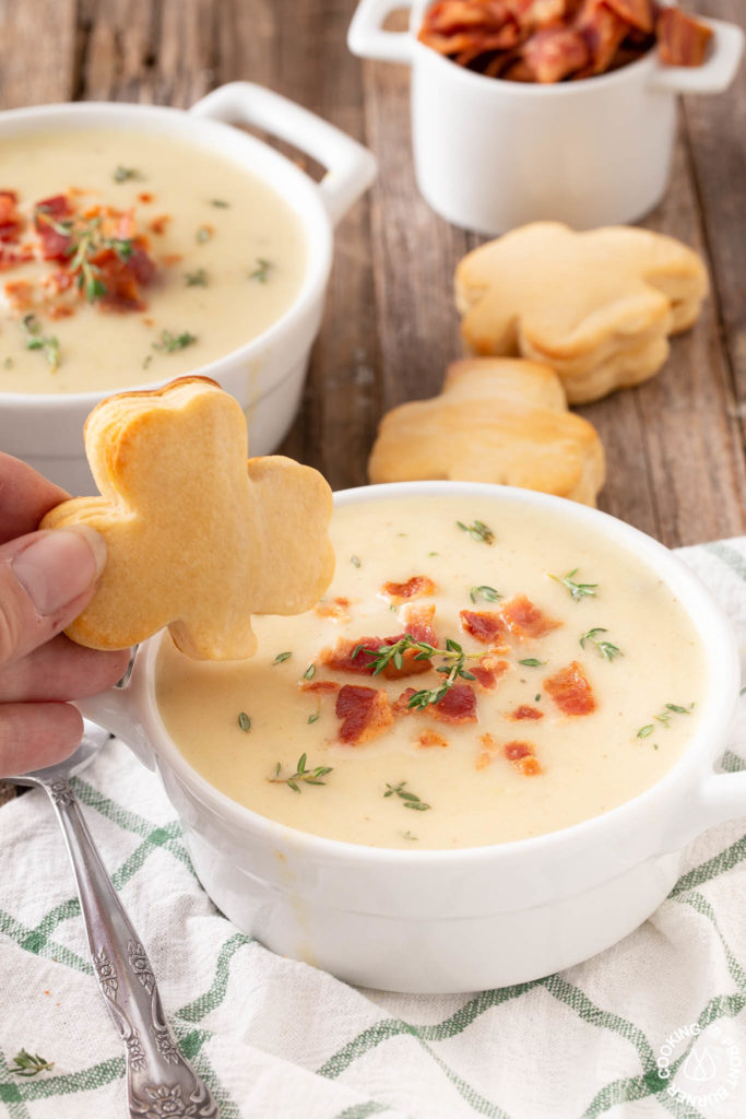 a shamrock biscuit dunked in soup