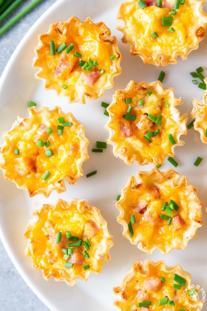 close up of mini quiche on a plate