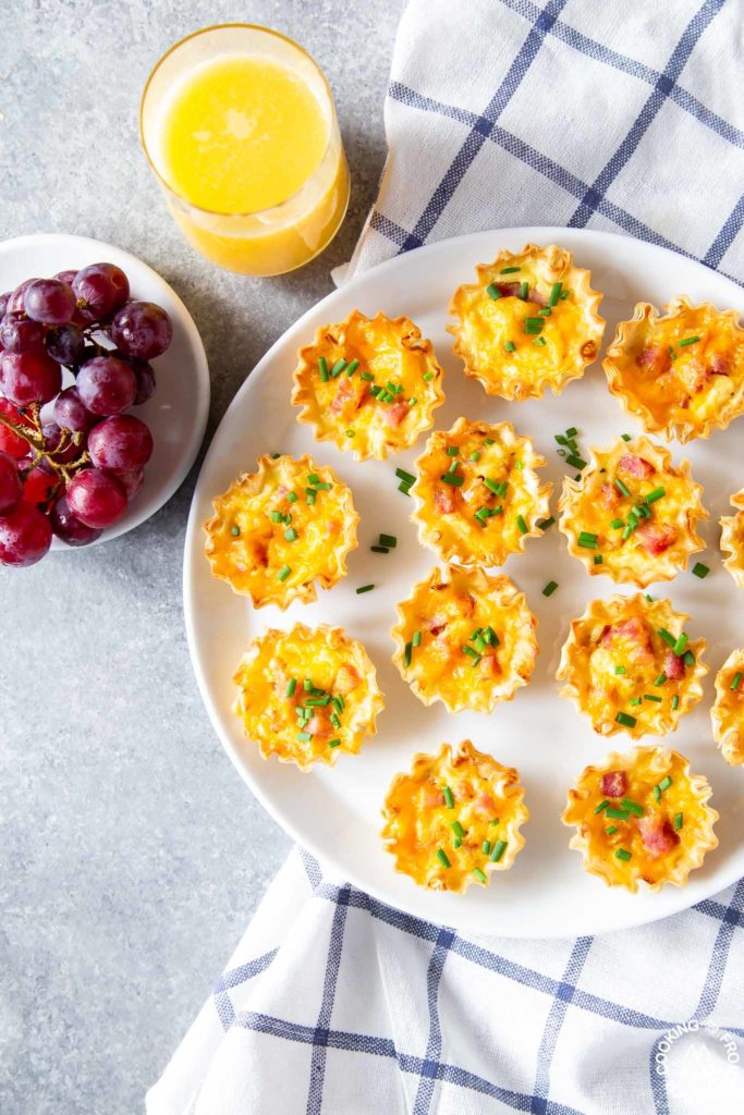 ham and cheddar quiche on a plate