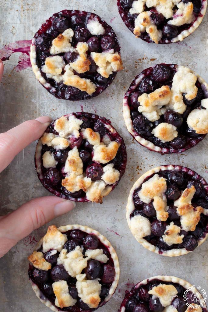 mini pies on a cookie sheet