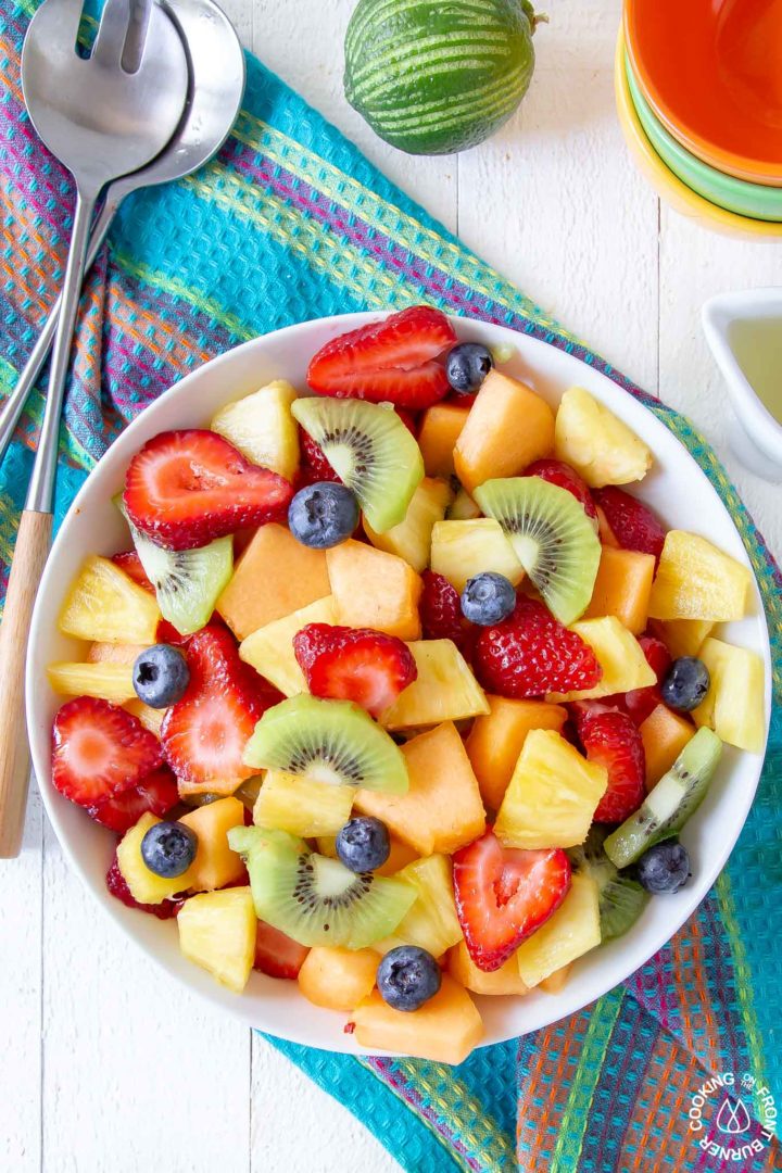 overhead shot of fresh fruit in a white bowl