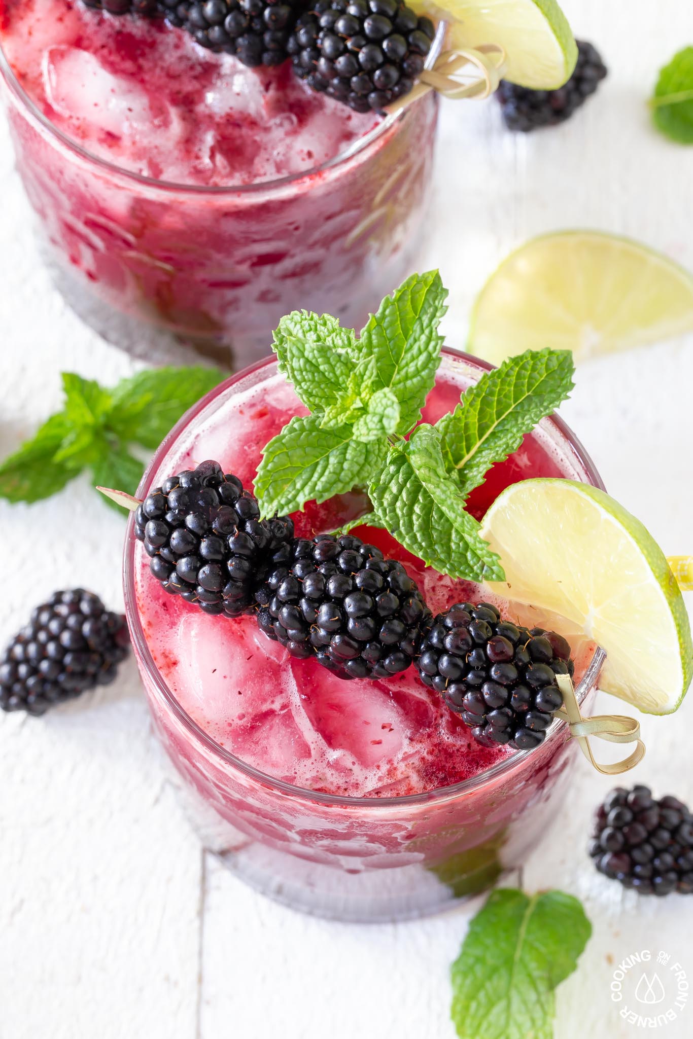 one blackberry gin bramble with a lime mint and blackberry garnish