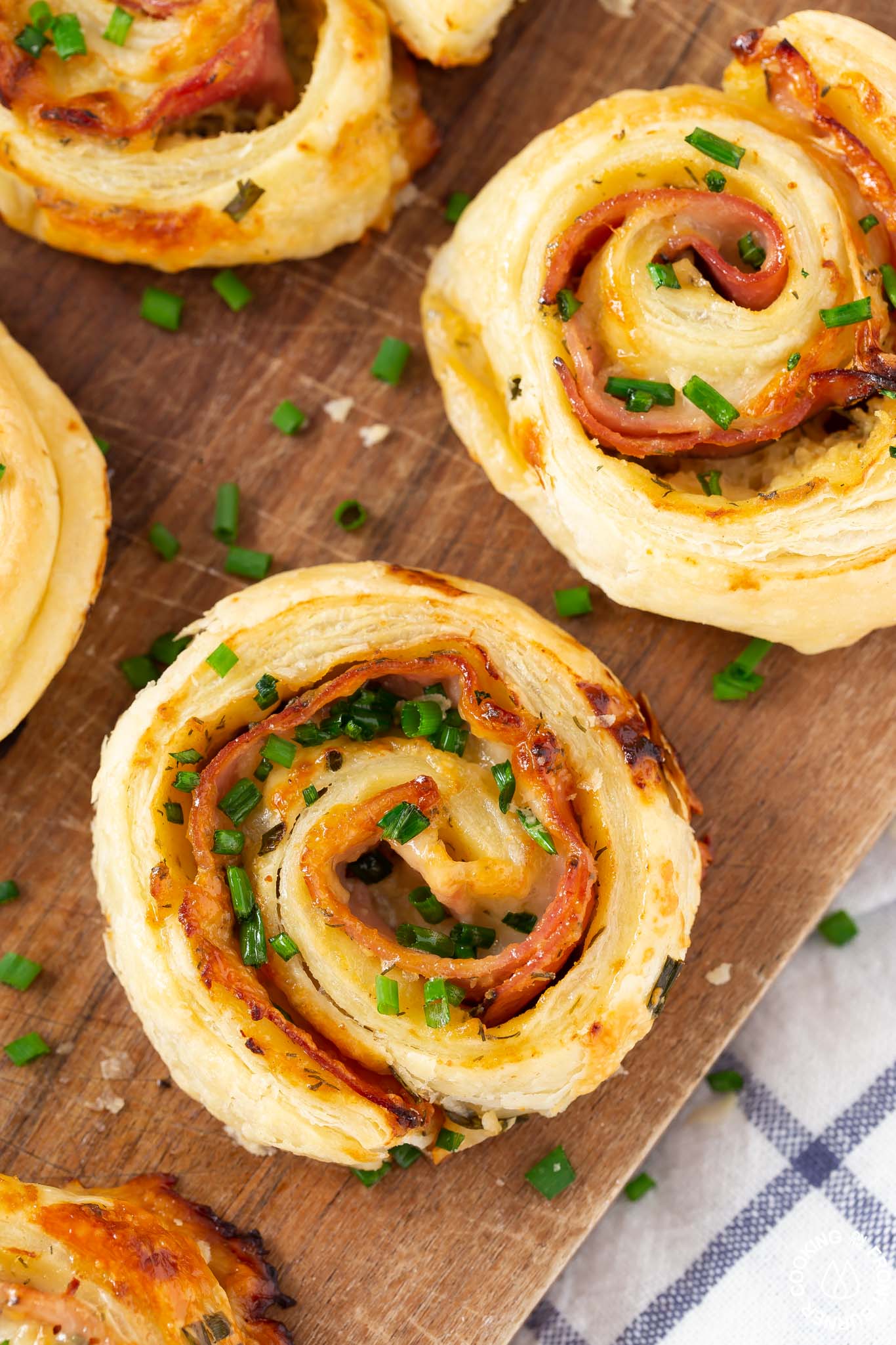 one ham cheese pinwheel on a board