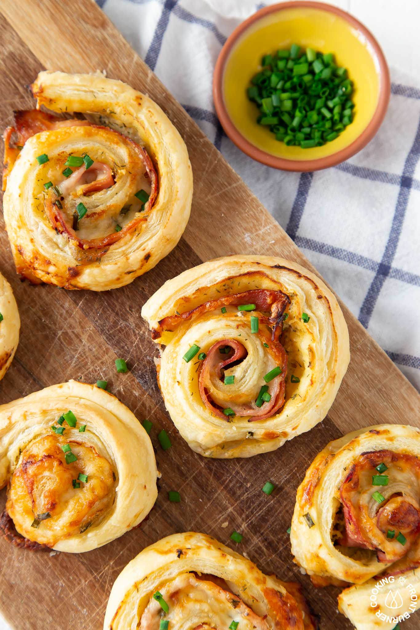 ham cheese puff pastry pastry appetizer on a board