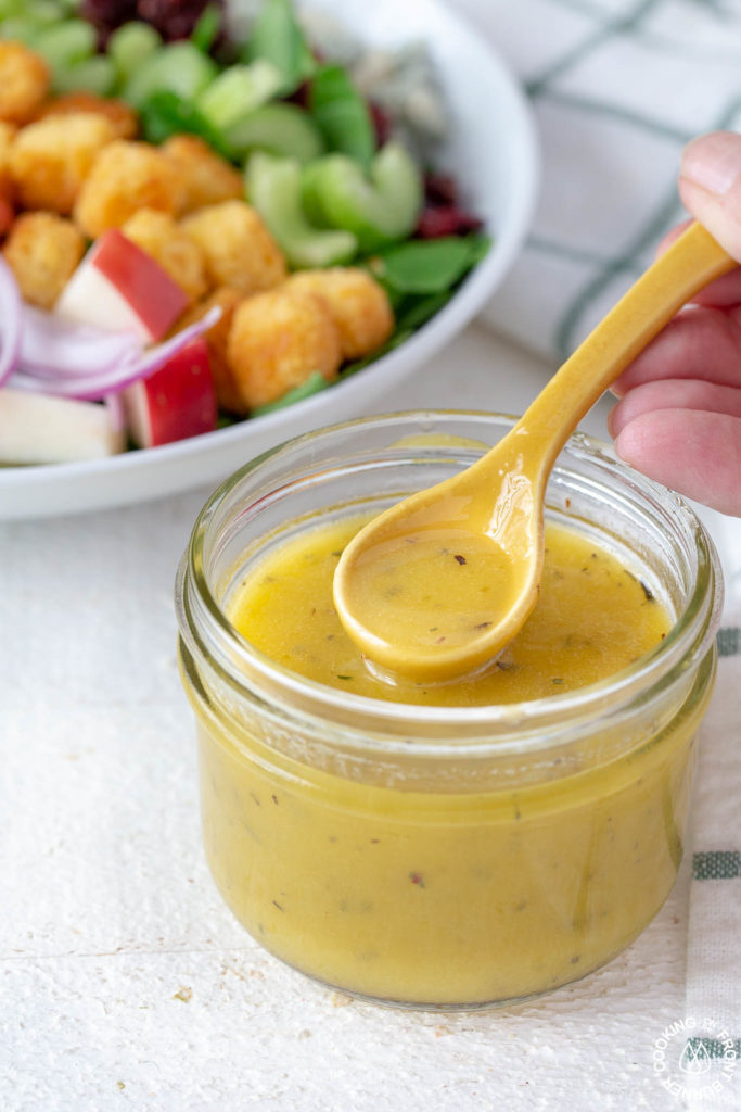 a jar of maple mustard vinaigrette