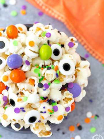 a close shot of a bowl of halloween snack mix