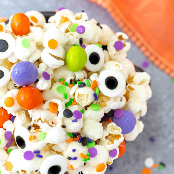 a close shot of a bowl of halloween snack mix