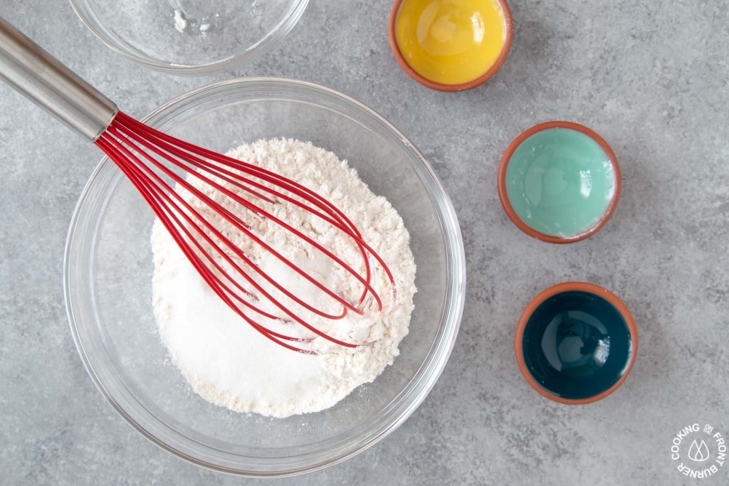 a whisk in a bowl of dry pancake ingredients