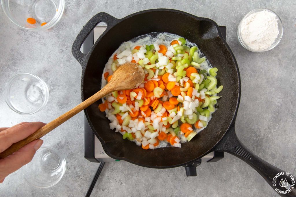 sauteing veggies in a skillet for pot pie