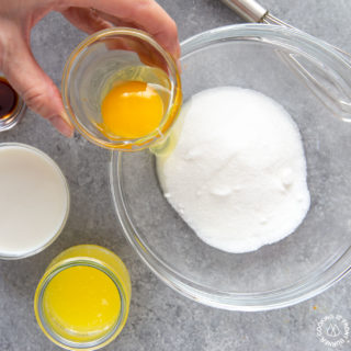 combining eggs with sugar for cranberry skillet bread