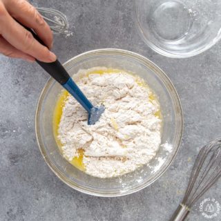 stirring wet and dry ingredients for cranberry skillet bread