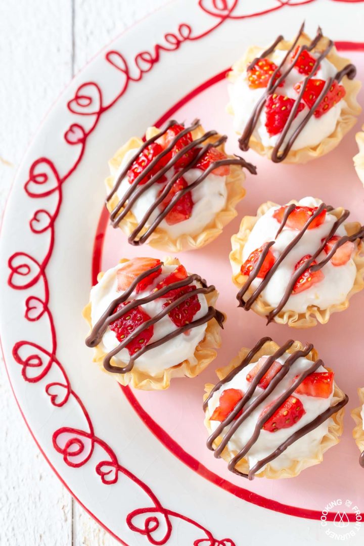 mini cheesecake bites in phyllo cups on a plate