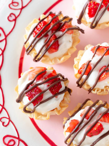 strawberry cheesecake phyllo cups on a plate