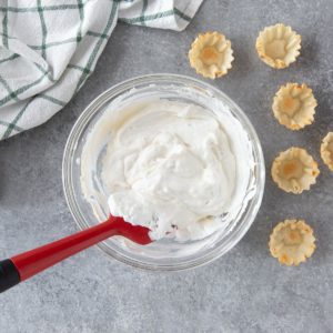 a bowl of no bake cheesecake mixture