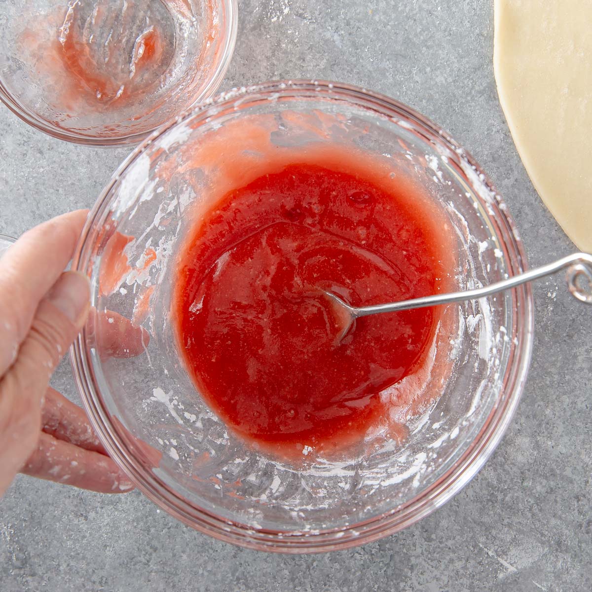 cornstarch and strawberry jam mixed in a bowl