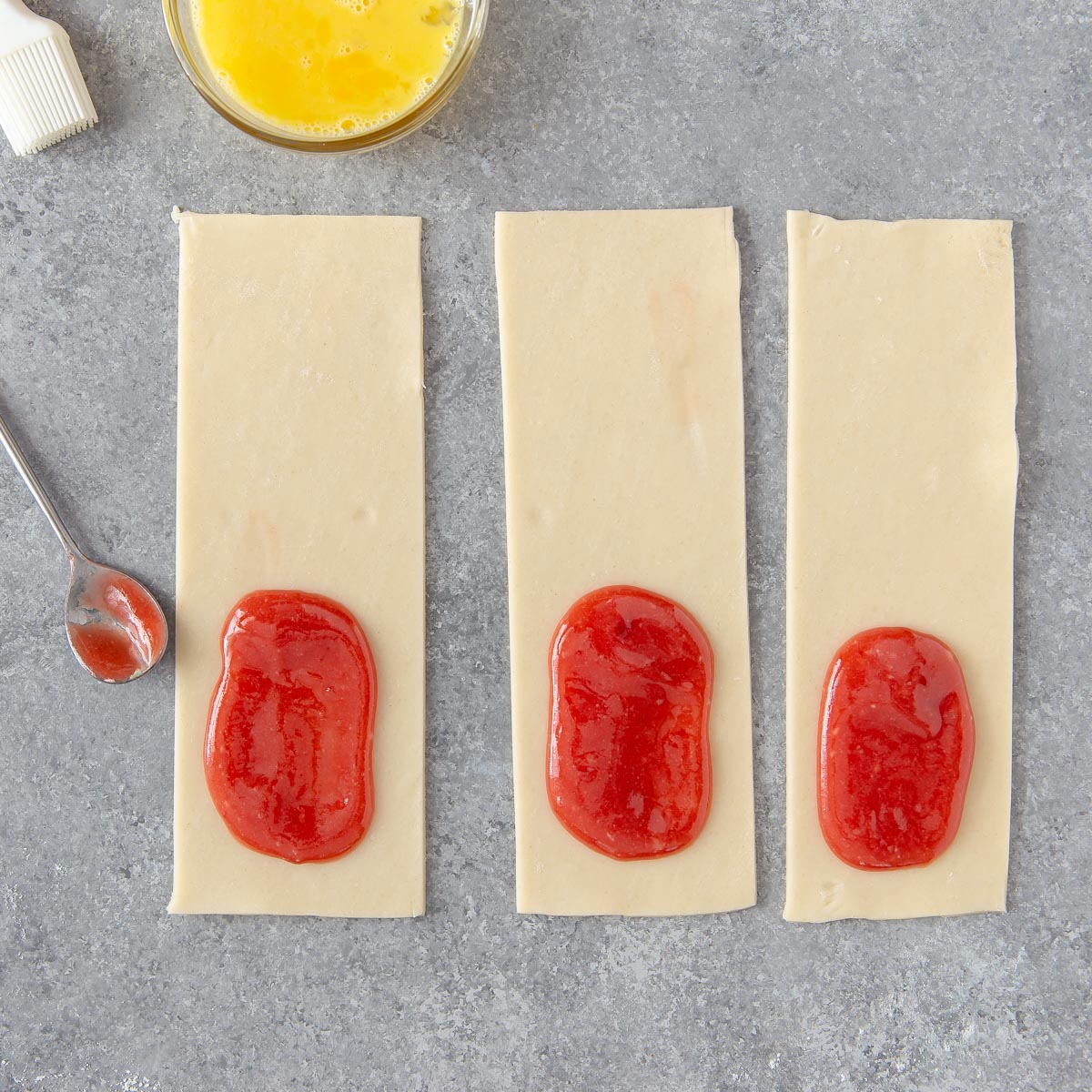 placing pop tart mixture on unbaked crust