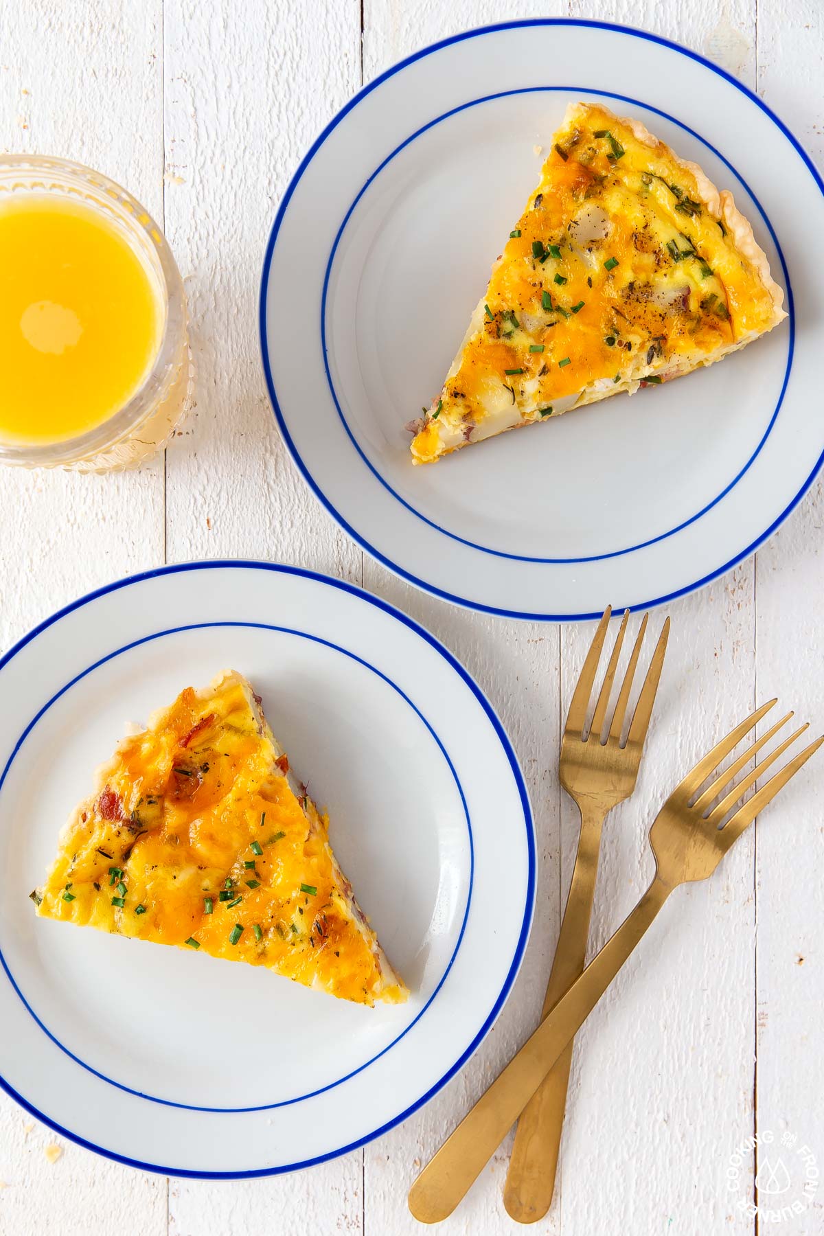 two plates with a slice of loaded baked potato quiche on each