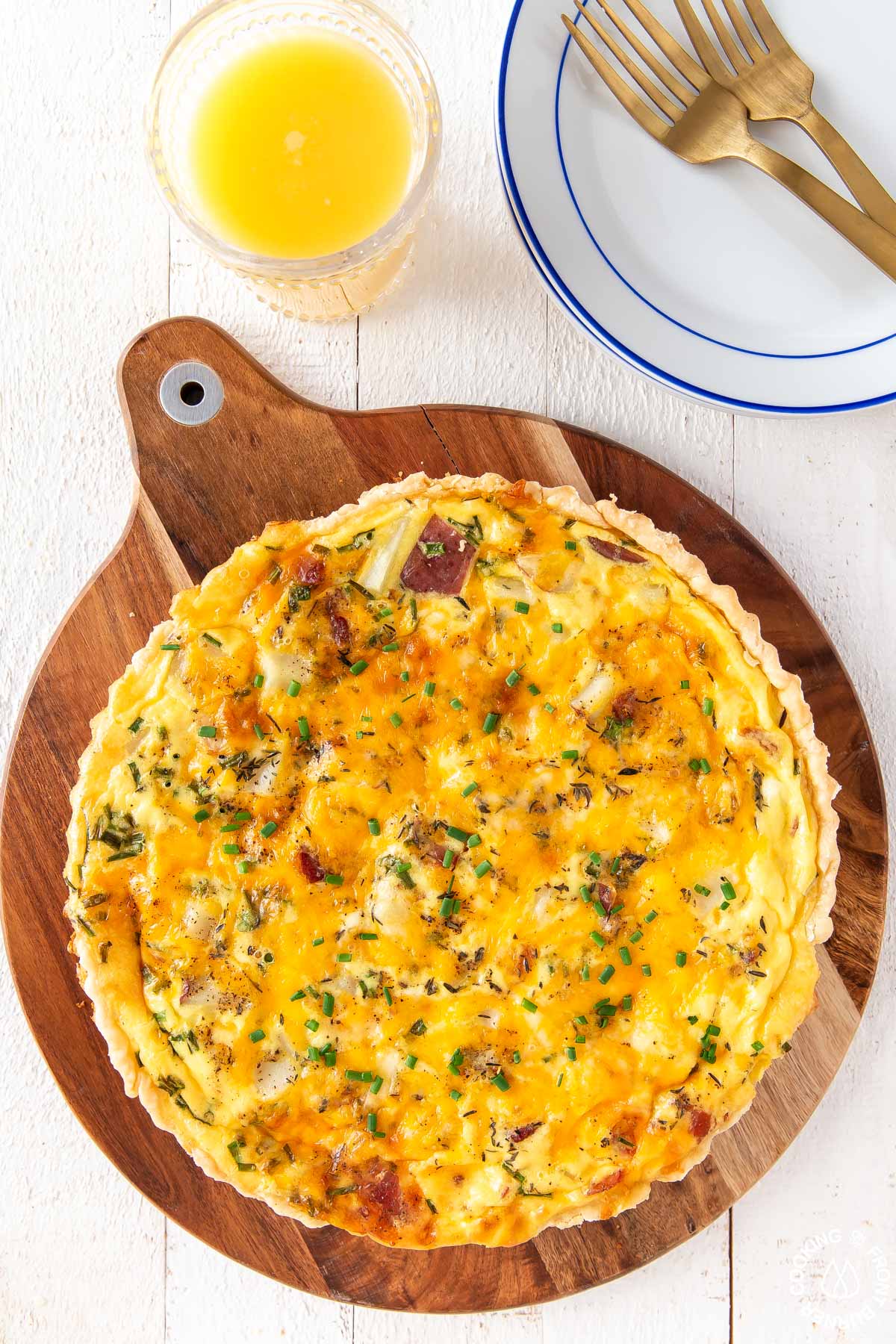 loaded baked potato quiche on a board