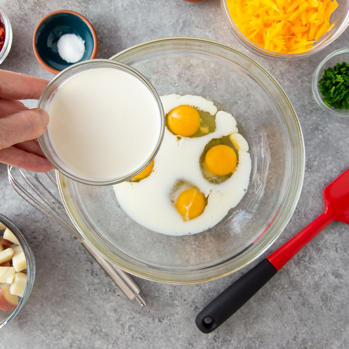 adding heavy cream into mixture