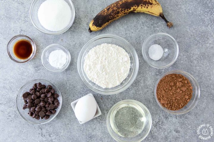 ingredients for chocolate chip banana muffins on a table