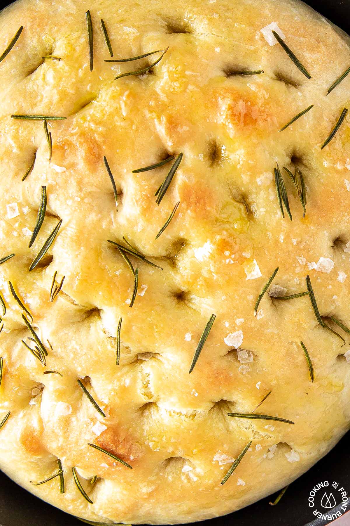 close up picture of fociaccia bread with rosemary and sea salt