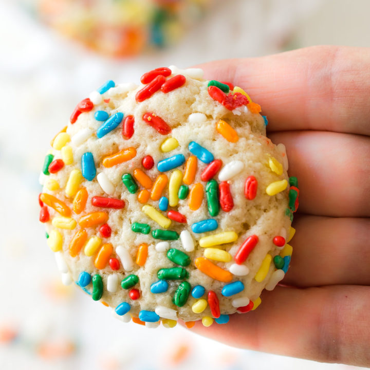 a chewy sprinkle cookie in a hand