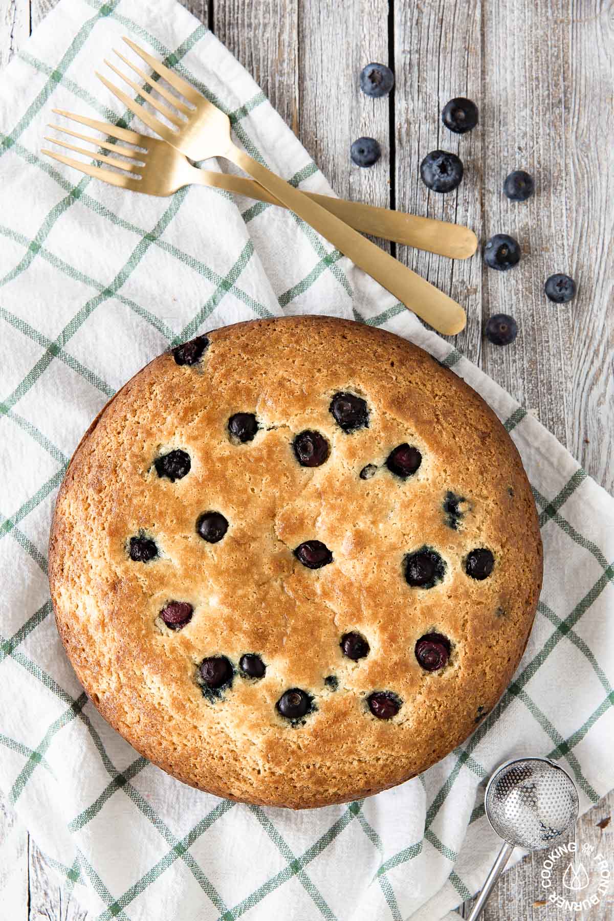 lemon blueberry ricotta baked sitting on a towel