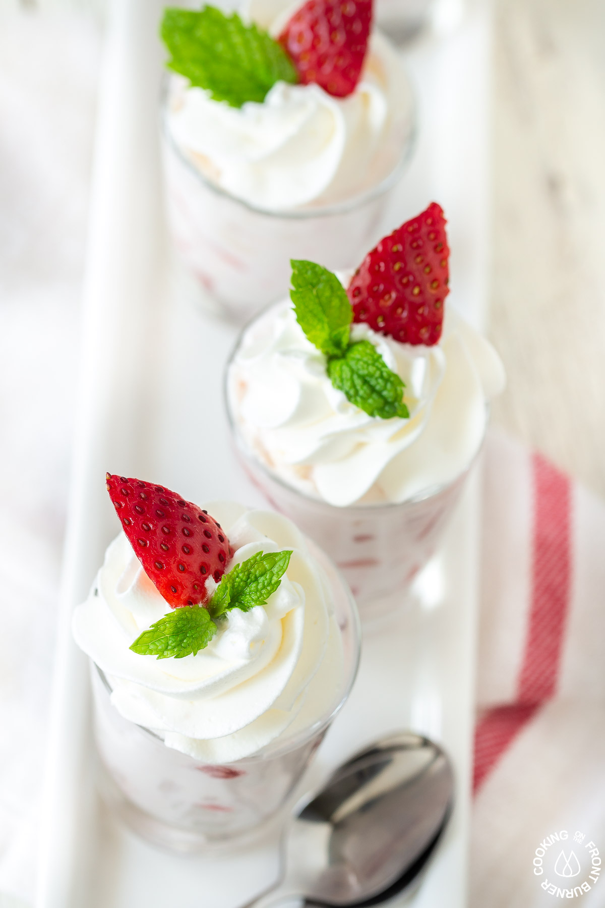 2 strawberry shooters on a plate