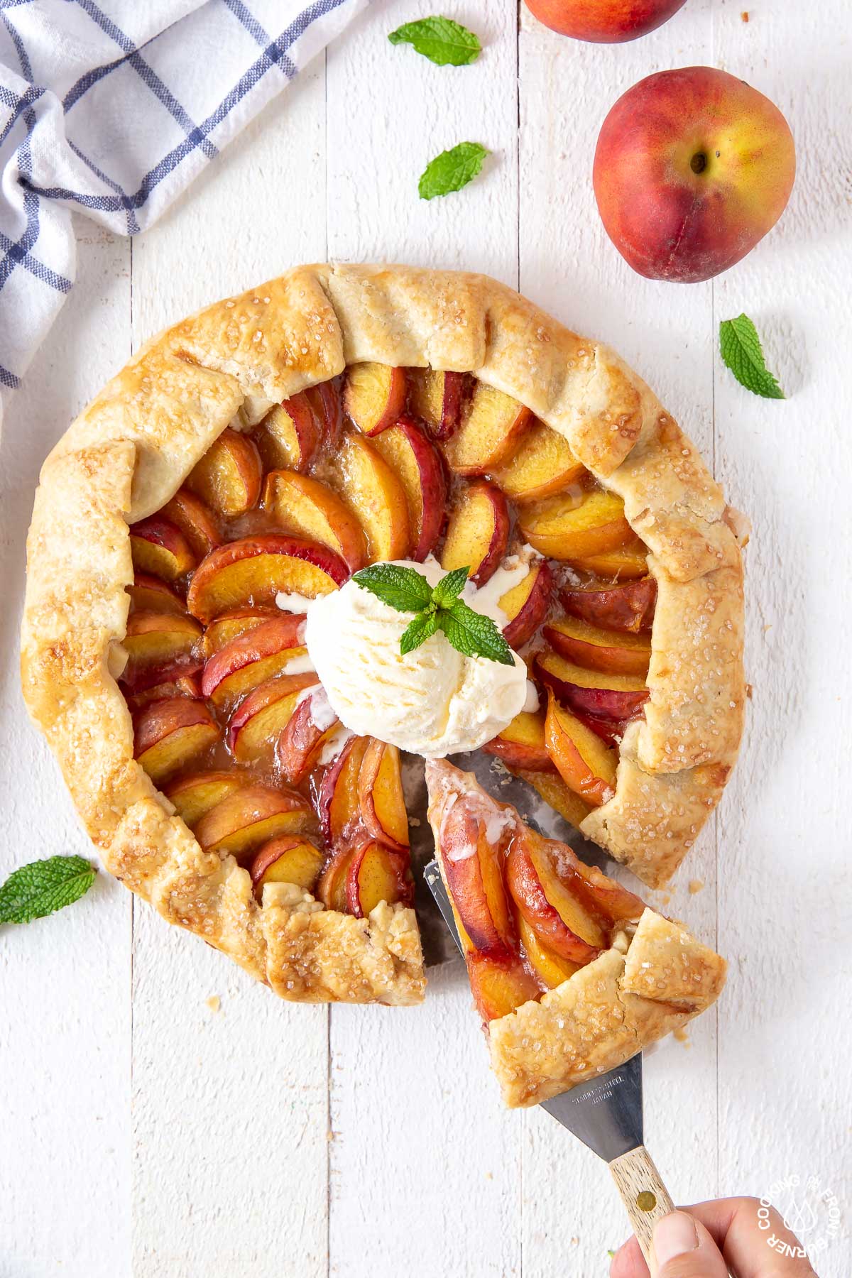 a peach galette with a slice cut out